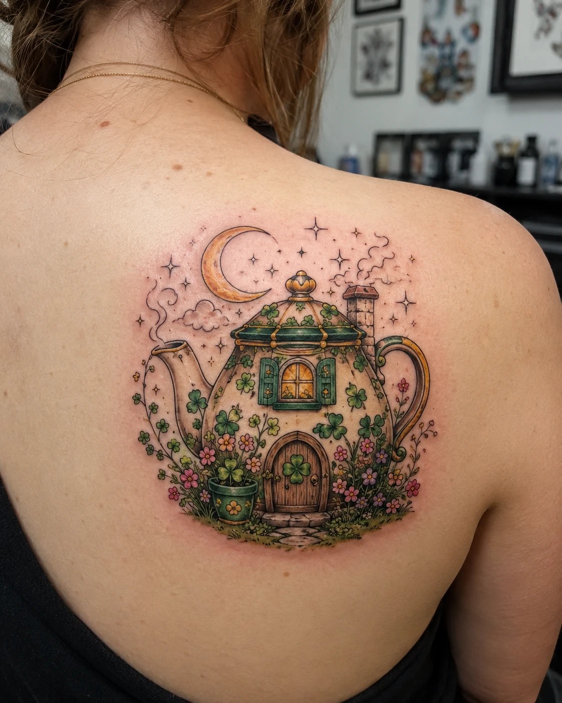 Whimsical teapot cottage glows beneath a crescent moon.