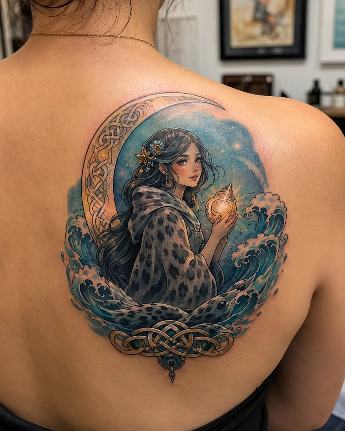 Dark-haired selkie holding a glowing shell among teal waves
