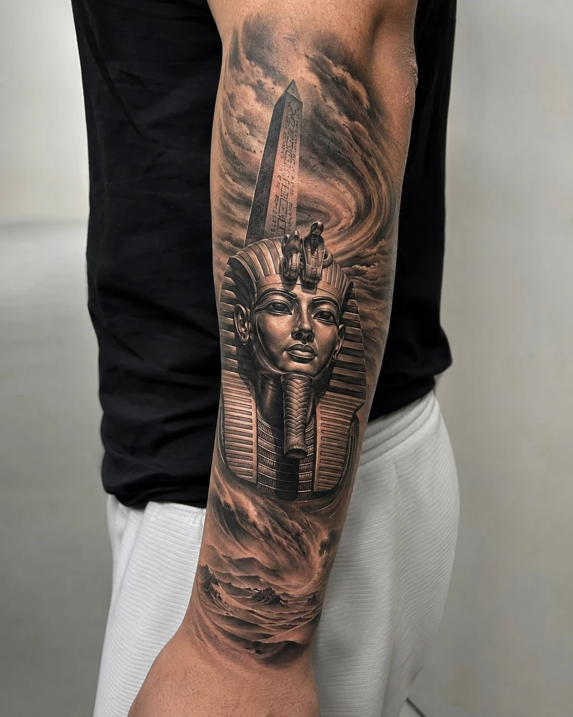 Ancient Egyptian pharaoh mask tattoo on the forearm