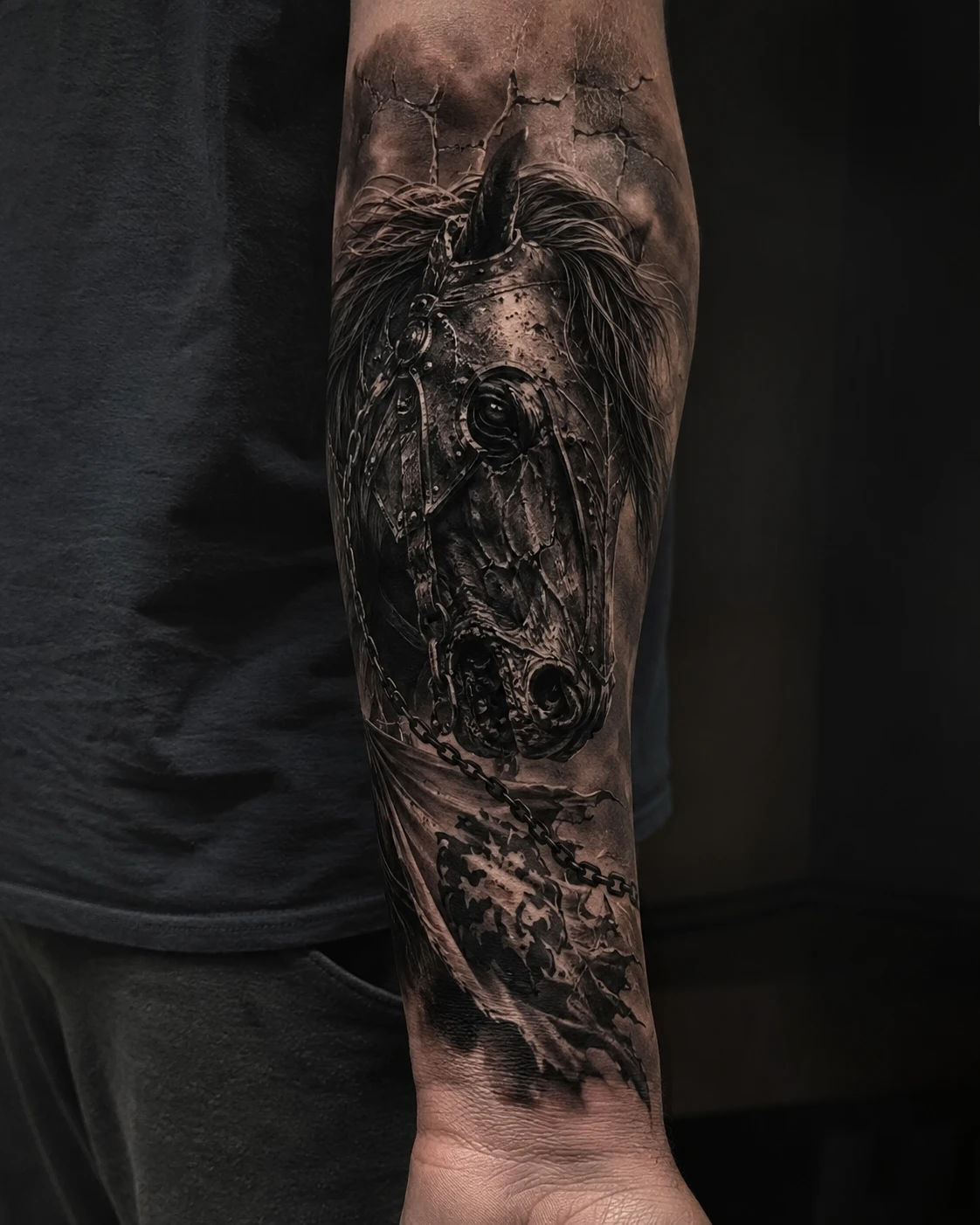 Armoured warhorse portrait tattoo in dark storm on forearm