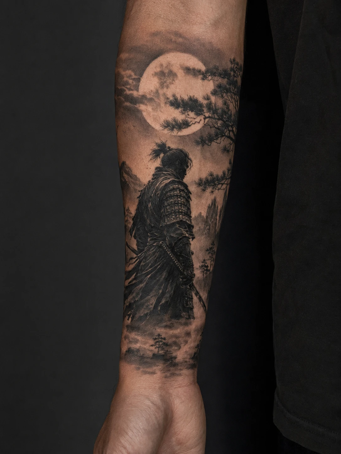 Lone samurai beneath full moon tattoo on the forearm