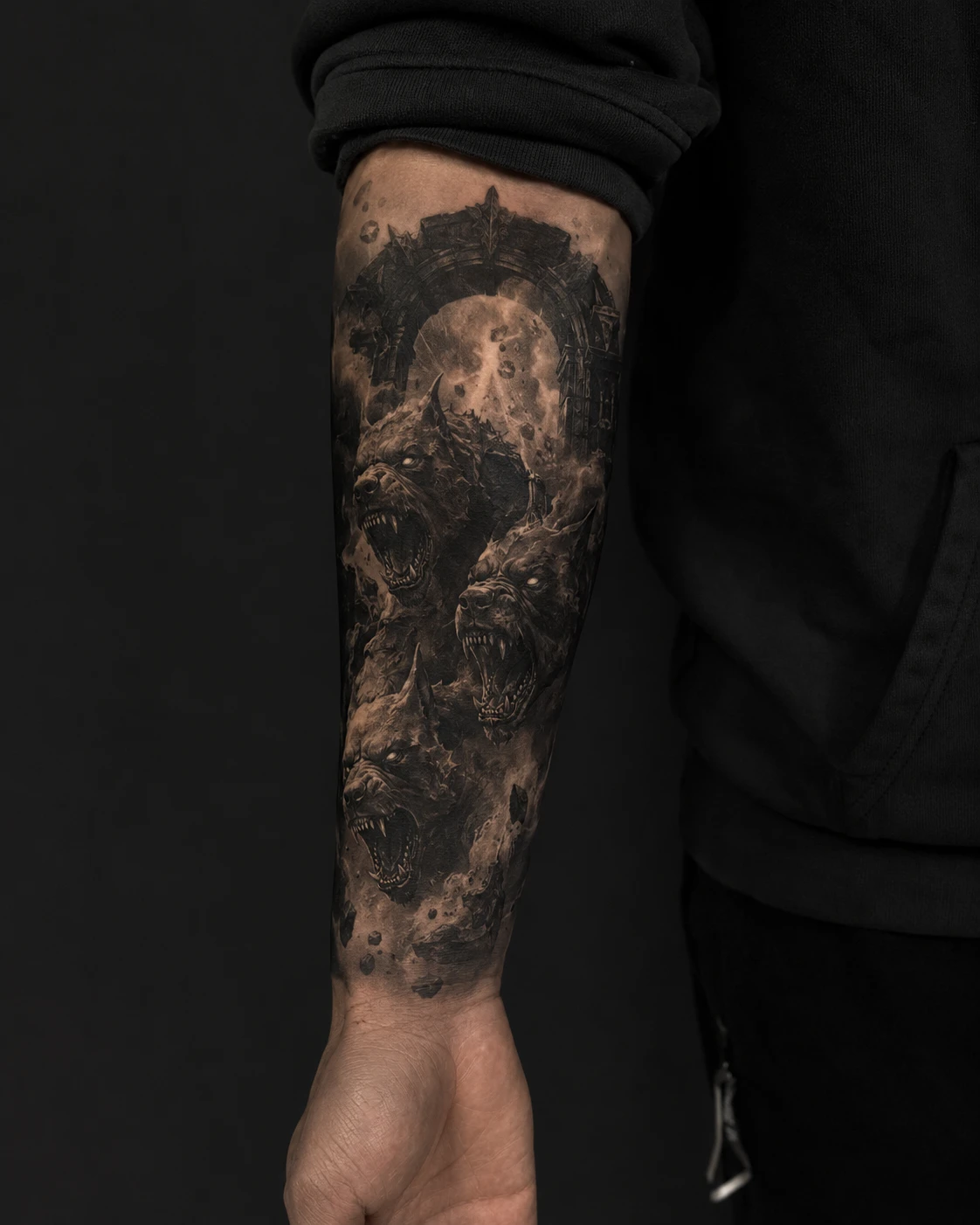 Three snarling hellhound heads emerge together through smoke, sharp teeth and heavy black shadow.