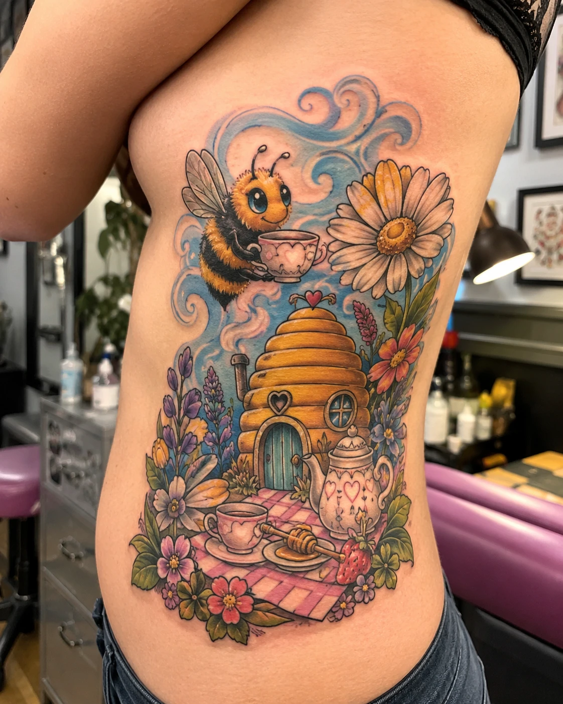 Cartoon bee and honey hive tattoo with flowers on ribs